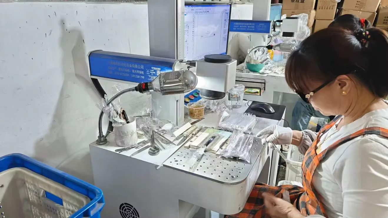 Operator working at a laser marking station